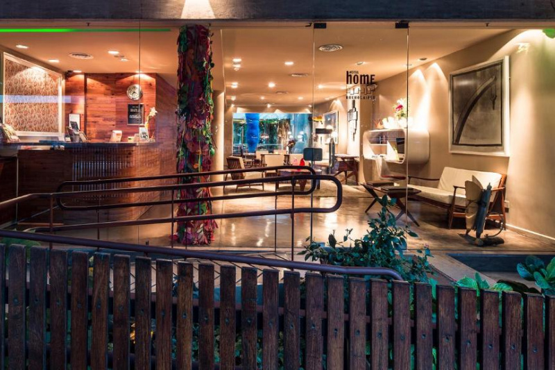 Access to the hotel entrance is up 2 shallow ramps with handrails. There are floor-to-ceiling windows and 2 step-free access through 2 glass doors.
