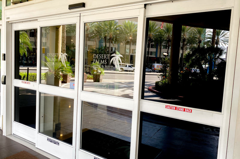 Access to the hotel is through 2 automatic glass doors.