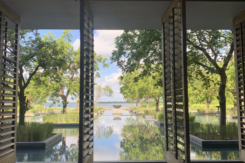 The spacious area has wooden shutters that open onto the waterside.