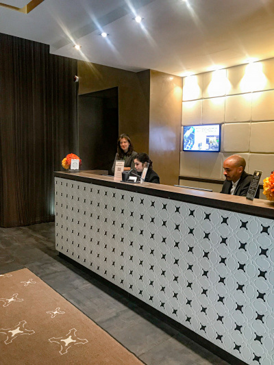 The hotel has a reception desk with a high counter. The area is step-free.