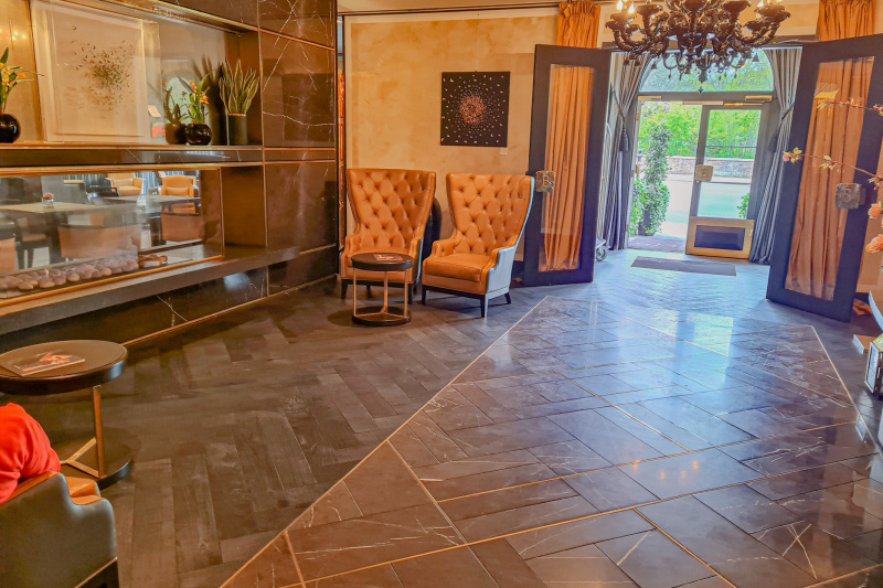 The spacious, step-free lobby has elegant high-back armchairs and coffee tables.