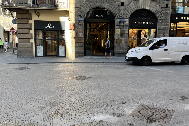 External view of the hotel entrance from the sidewalk across the street.