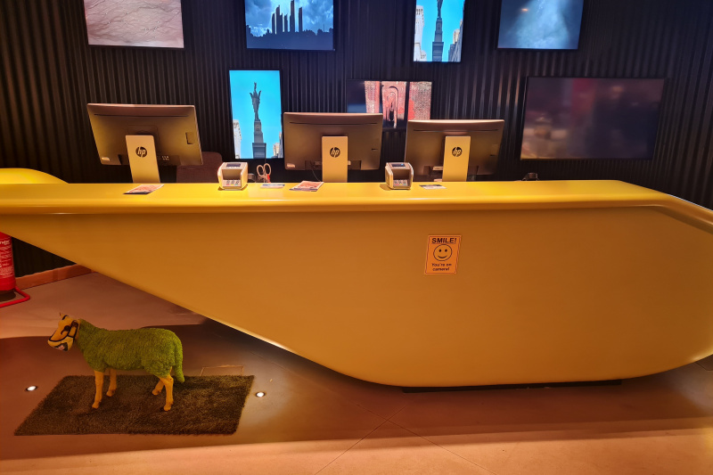 The reception desk has a high counter and is in a step-free area.