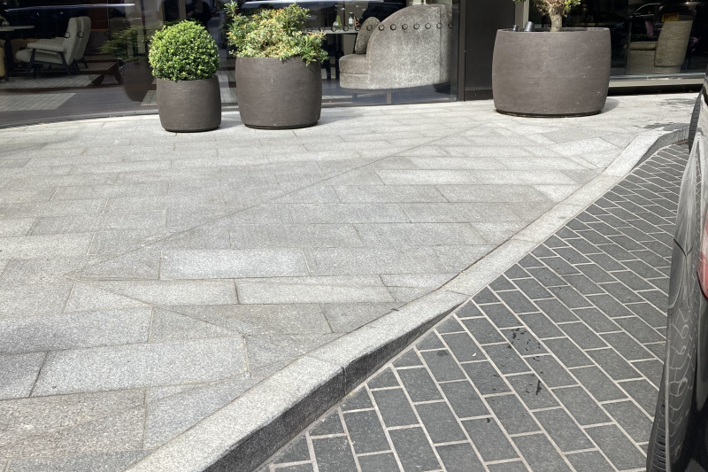 The drop-off zone has a dropped kerb providing step-free access to the sidewalk leading to the hotel entrance.