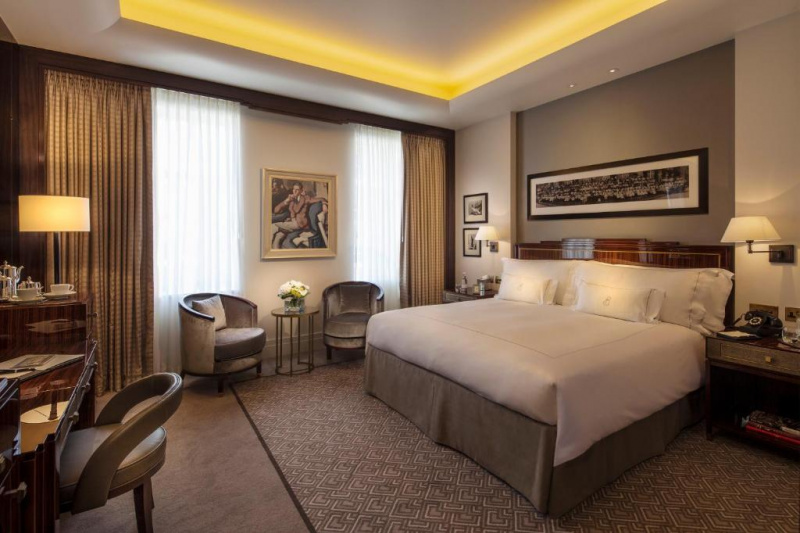 The spacious room has 1 king-sized bed with nightstands. There are 2 elegant chair with a coffee table, a workstation and a chair. There is plenty of floor space.