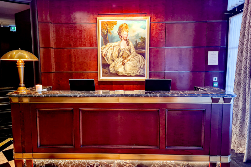 The reception area has a high check-in desk.