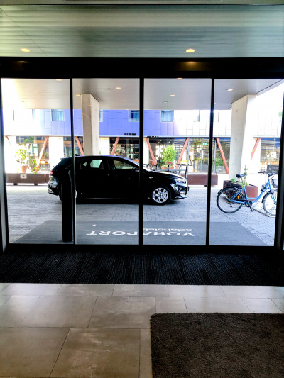Automatic glass sliding doors lead from the lobby onto the driveway.