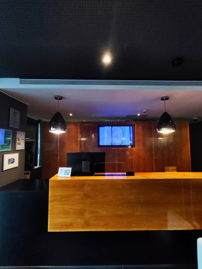 The check-in desk has a high counter with a lowered section.