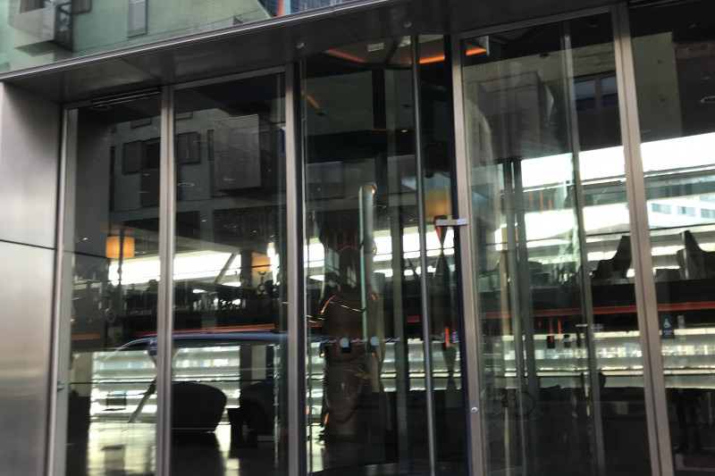 There is a cobbled sidewalk leading to the hotel entrance. Access to the hotel is through a revolving door.