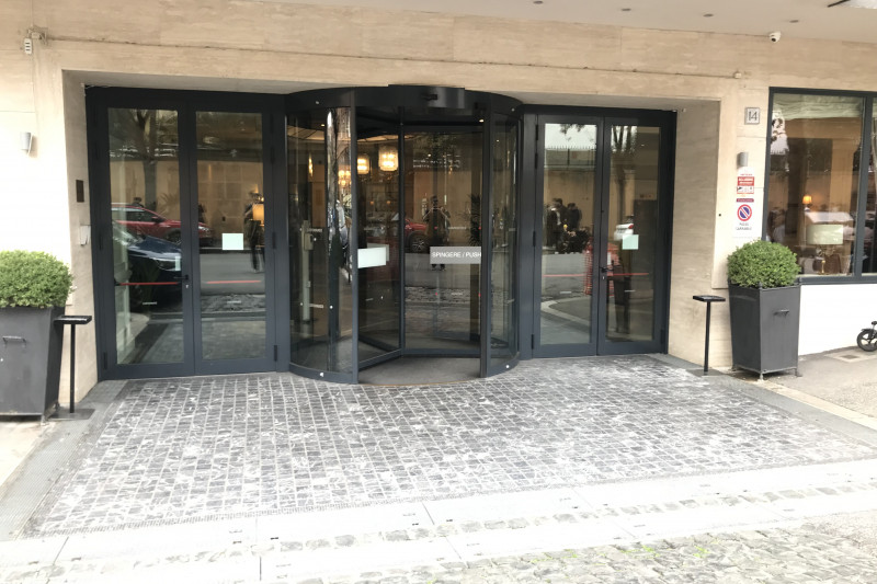 Access to the hotel is from the step-free, cobbled walkway. There is a revolving door with manual doors on either side.