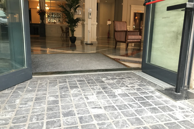 Access to the hotel is step-free and through manual doors leads to a spacious lobby.