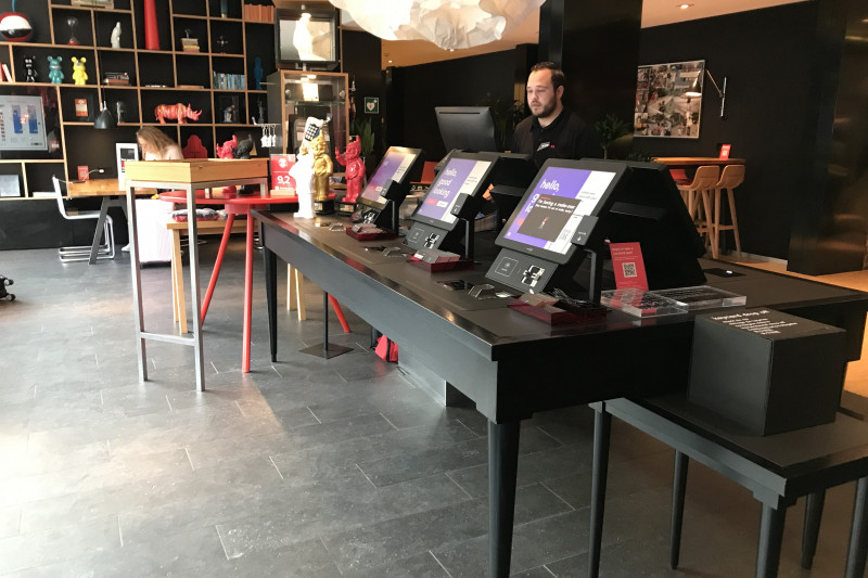 In the center of the room there is a table with 6 computer screens.