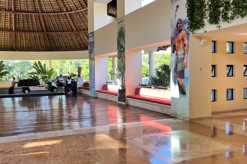 Access to the hotel is along a wide, step-free corridor with padded seating on one side.