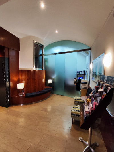 The spacious lobby has a padded bench, 2 low pouffes, and a brochure stand.