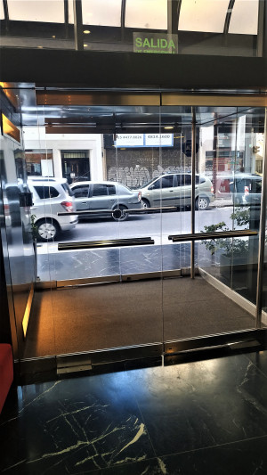Access to the hotel is through 2 sets of glass doors. There is a doormat in between the doors.