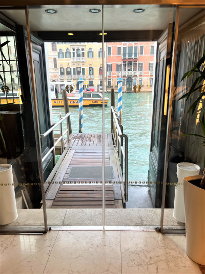 The hotel doors lead out onto a pontoon bridge on the Grand Canal.