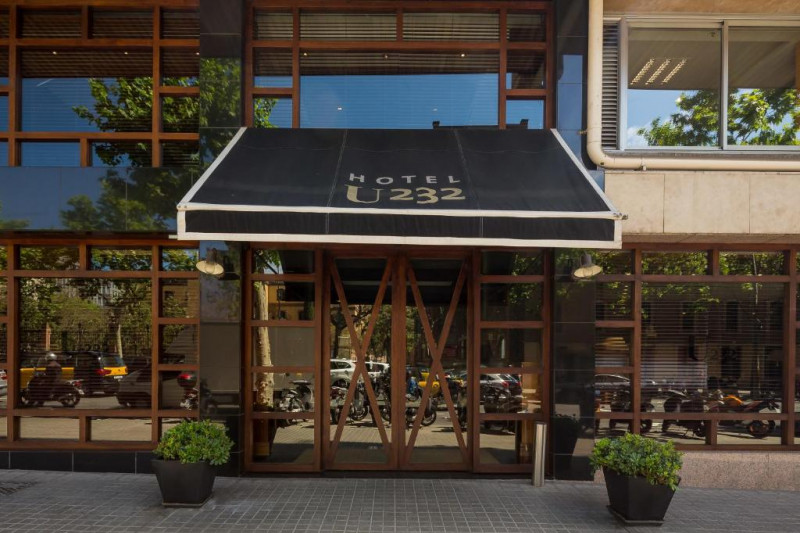 Access to the hotel is from a step-free cobbled sidewalk through 2 wooden and glass sliding doors.