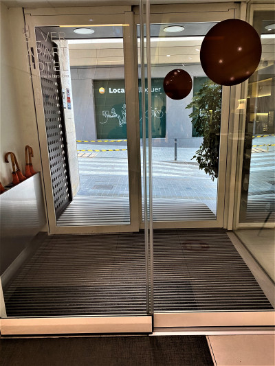 There are 2 sets of glass doors leading into the hotel.