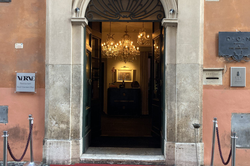 The entrance to the hotel is from the sidewalk. There is a small step up to the entrance.