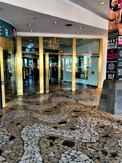 To the side of the main entrance door, there are 2 sets of manual double, glass doors. There is also a single manual door.