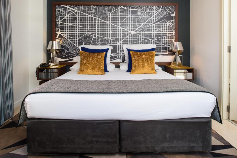 This room has a king-sized bed with nightstands on either side.