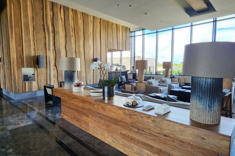 The spacious seating area has assorted tables and chairs. The area is step free.