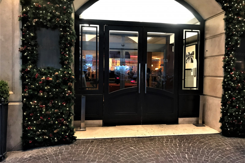 Access to the hotel is from the cobbled sidewalk. There are 2 sets of  glass doors.