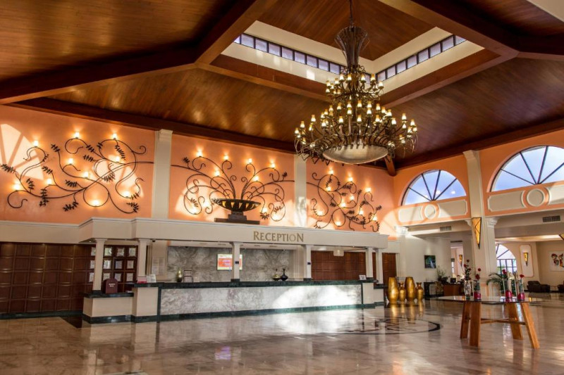The hotel lobby is spacious and step-free. The reception desk is long, with a high counter.
