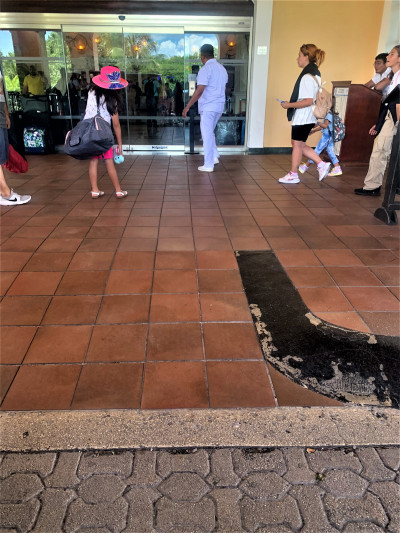There is a wide, paved ramp leading up to the hotel entrance.