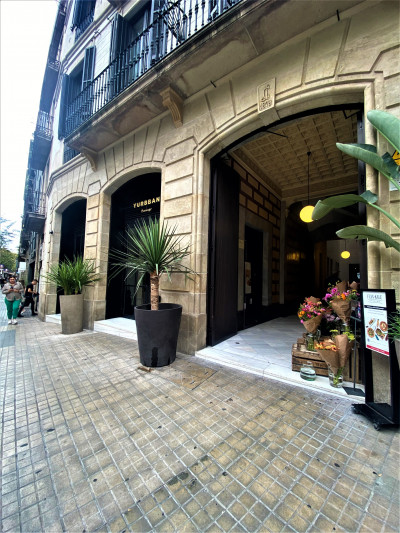 Access to the hotel is from the sidewalk. There is a small step leading into the covered entrance.