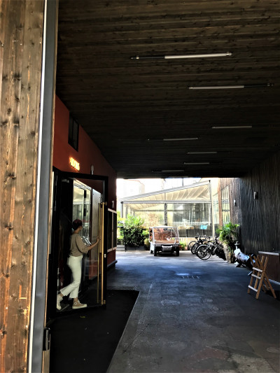 Access to the hotel is from a drive through area. There is a manual, glass door.