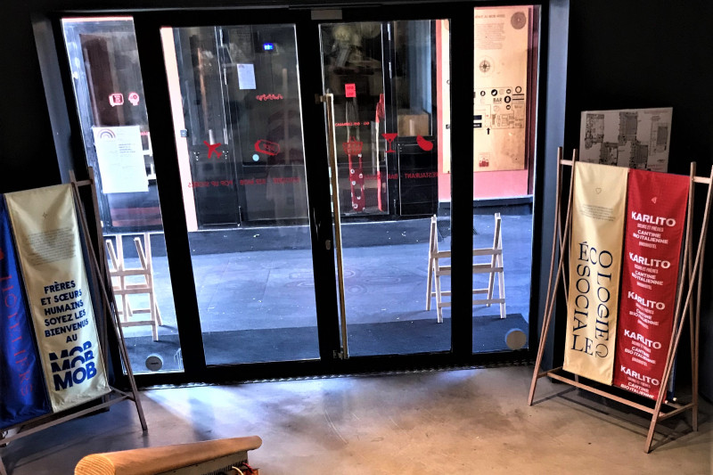 The lobby has 2 glass doors leading onto the sidewalk.
