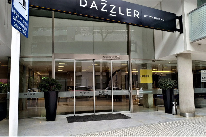 Access to the hotel is through sliding, glass doors from the sidewalk.