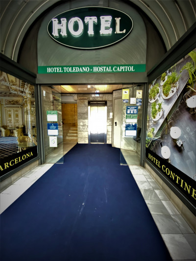 Access to the hotel is along a corridor. There is an elevator and a flight of steps.