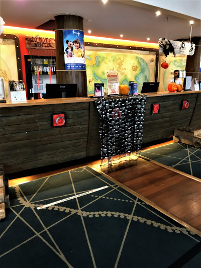 The spacious reception area has a high check-in desk.