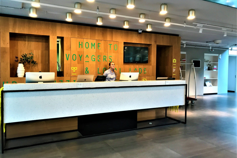 The spacious reception area has a high check-in desk.