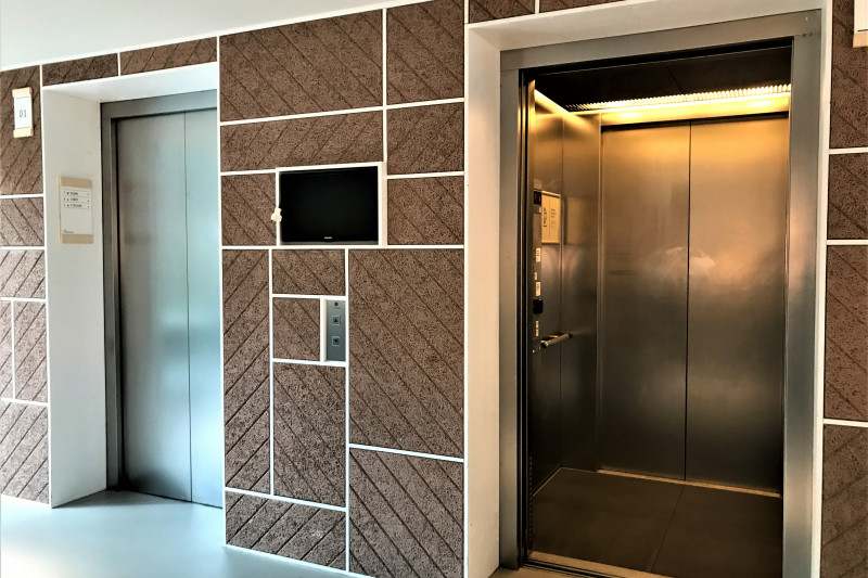 The hotel elevators have handrails and accessible call buttons.