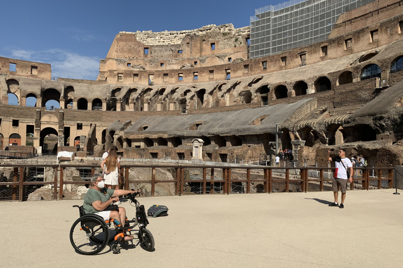 Tourists explore the second floor of the Colosseum structure