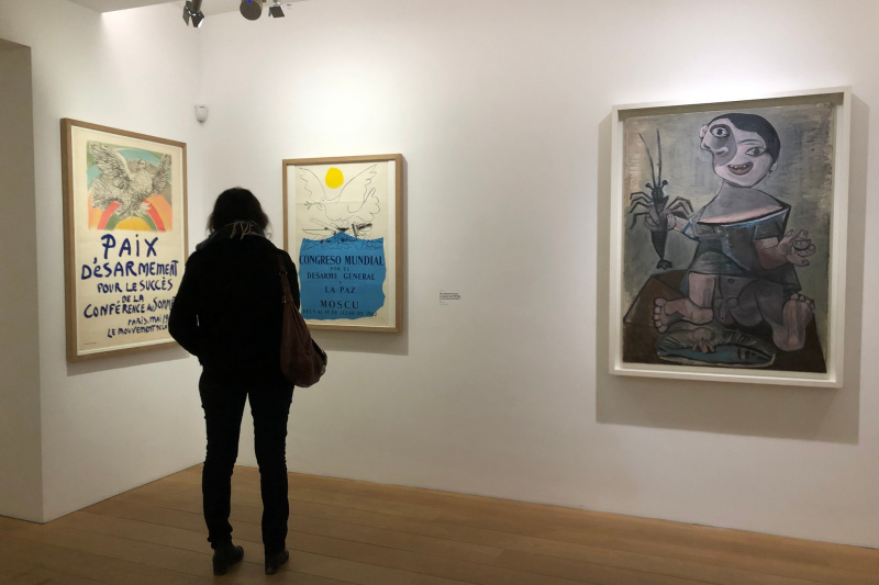 A visitor gazing at a painting
