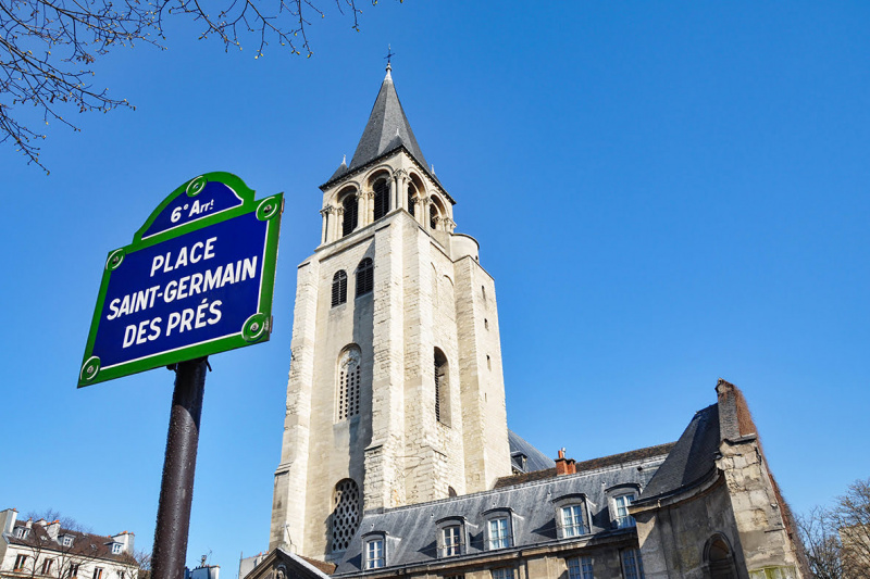 The church of Saint-Germain-des-Pres, with a sign in the foreground.