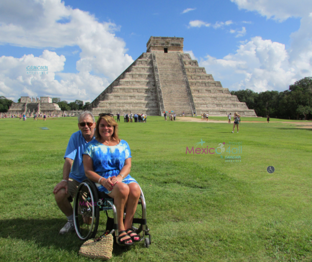 A wheelchair user poses for a picture in Chichen Itzá