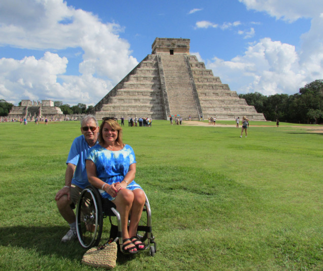 A wheelchair user poses for a picture in Chichen Itzá
